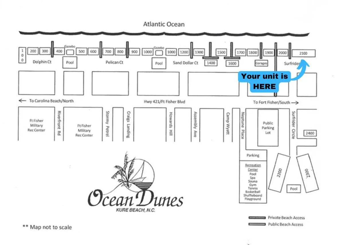 A sweeping aerial view of the Ocean Dunes resort, showcasing the direct beach access, the Atlantic Ocean's sparkling waters, and a variety of recreational amenities visible across the property. Families and groups can be seen enjoying the sand and community areas, capturing the lively atmosphere of the resort’s beachfront setting.
